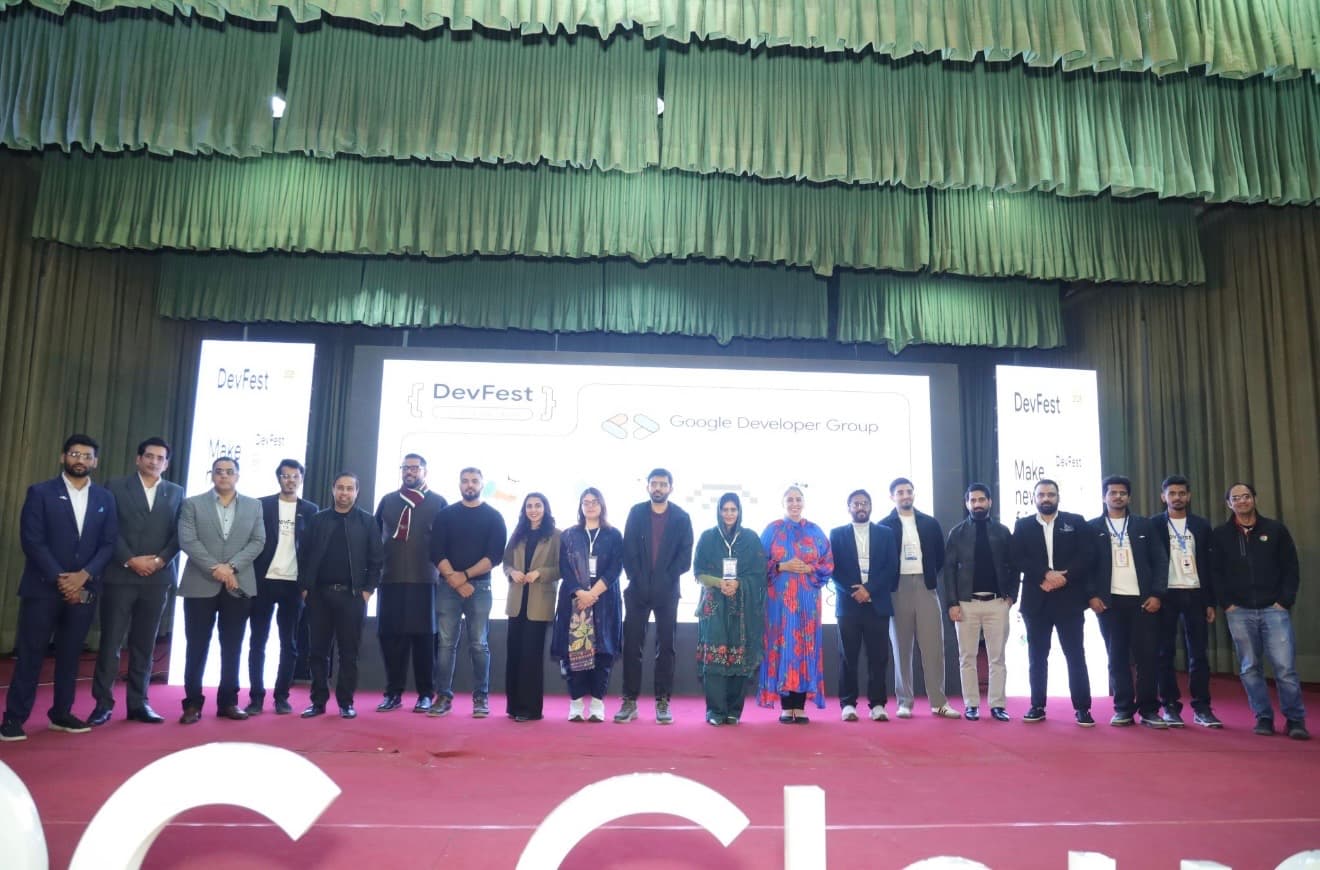 Speakers and organisers on stage at DevFest AmplifAI 2025