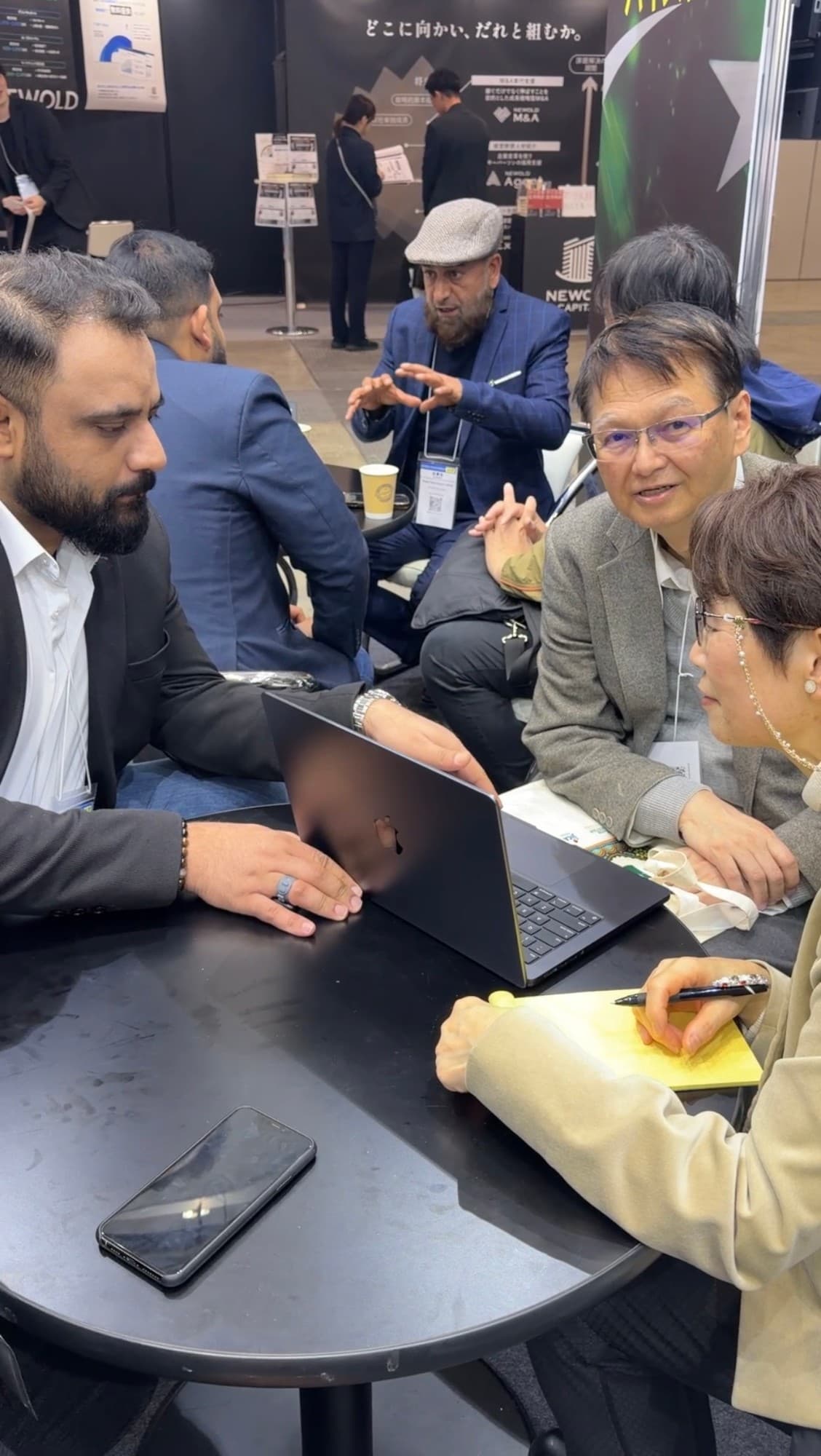 Japanese visitors taking notes through a NexaVoxa walkthrough